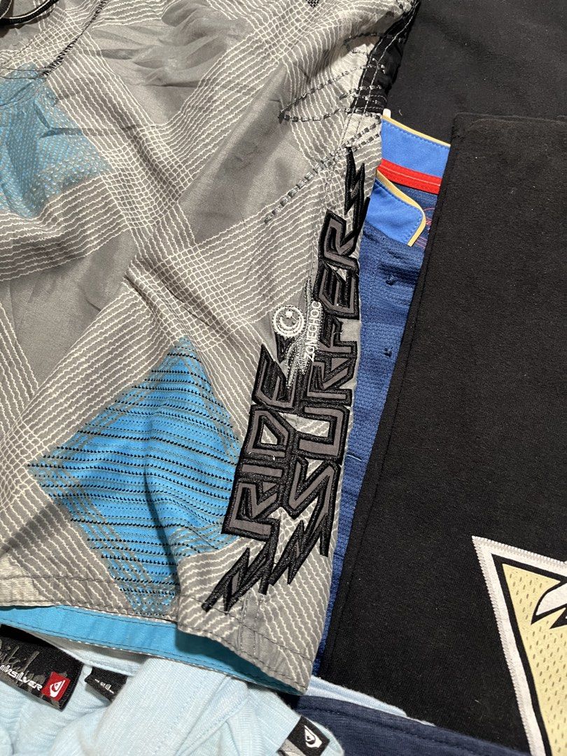 Zone Choc Board Shorts Grey Blue Plaid Surf Style (Category: Swim Trunks & Board Shorts) located in Baao. Submitted by plainclothesdept (Listing ID 1464530365, Image 2). Description: Zone Choc Surf Board Shorts waist - 32-36 in. length - 16 in. hem - 11 in. no flaws - Zone Choc board shorts - Grey with blue and black plaid pattern - Side cargo pocket - Drawstring waist - Ideal for beach or pool - Made from 100% polyester.