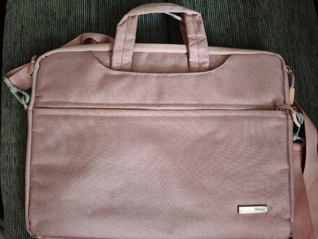 15 in Laptop Bag - Pink (Category: Laptop Bags & Sleeves) located in Quezon City. Submitted by miletdeclutters (Listing ID 1464596087, Image 1). Description: - GM Mill pink laptop bag - Main compartment with soft lining - Front pocket for accessories - Comes with shoulder strap and handles - Ideal for carrying your laptop and essentials -Can fit 15 in laptop -Barely used.