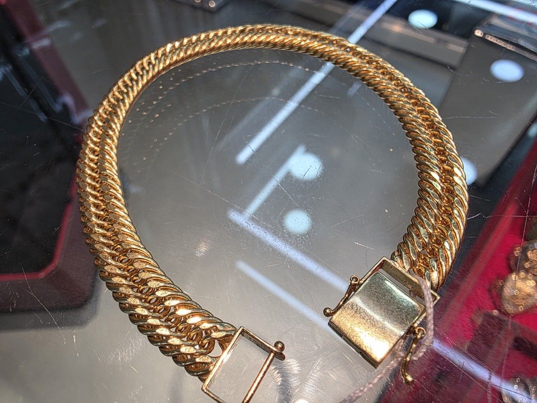 18K Gold Double Chain Bracelet 17.4g (Category: Bracelets) located in Manila. Submitted by trumpisthedevil (Listing ID 1464646439, Image 2). Description: - Genuine 18K gold bracelet - Chic double chain design for a substantial look - Secure and easy-to-use clasp - Bright, shiny gold finish - Substantial weight of 17.4 grams - Versatile for everyday wear or special events.