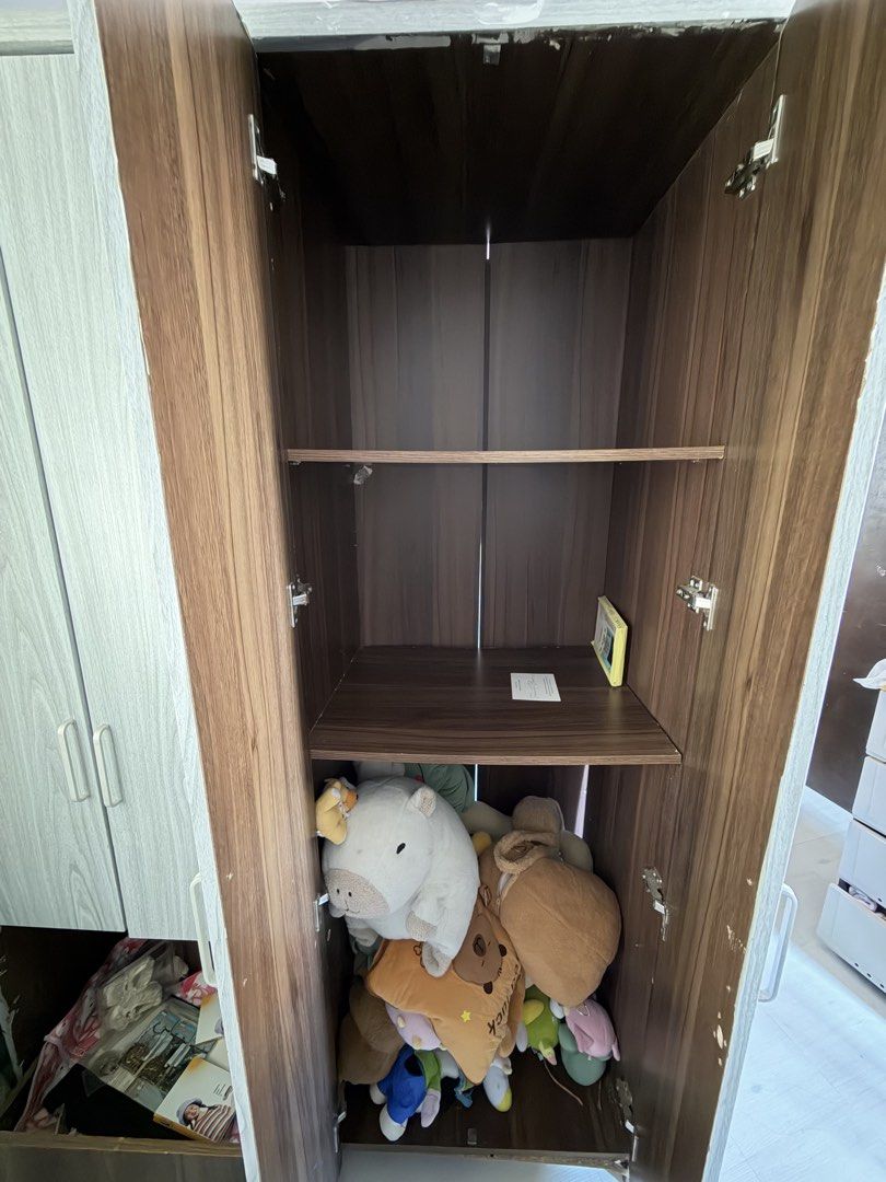 1k Cabinet with Issue (Category: Shelves, Cabinets & Racks) located in Agdangan. Submitted by gonutt.donut (Listing ID 1464635721, Image 2). Description: Inistockan ng damit at stuffed toys. Issue: • may part sa likos na naka angat pero pwede naman gawain or ikabit ulit. • 2 drawers sa left side, hindi na naibabalik dahil nasira yung slide ng drawers. pwede naman tanggalin kung gustong naka open nalang. • dinikitan ko ng gray wallpaper sticker ka