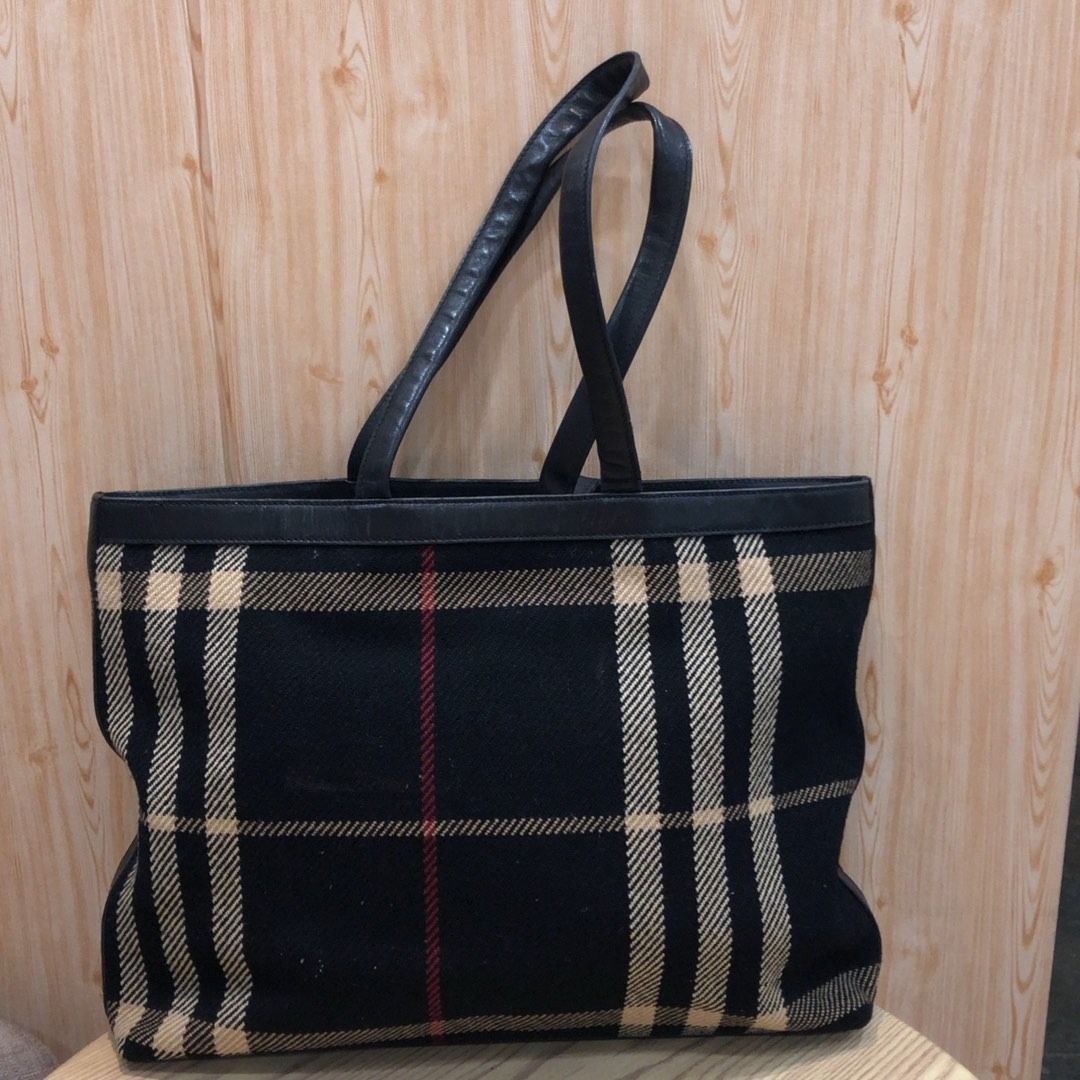 267009499 BURBERRY BAG BURBERRYS OLD TYPE WOOL (Category: Luxury Bags & Wallets) located in Taguig. Submitted by ecoring.ph (Listing ID 1464589395, Image 1). Description: ◆CONDITION: B- ◆DESCRIPTIONS: (Other defects/info:) OUTER: The body of the bag is stained and dirty, is fraying due to the fabric used, and shows signs of use. The bottom corners of the bag are stained and dirty, show signs of scuffing, and show signs of use. The bottom of the b