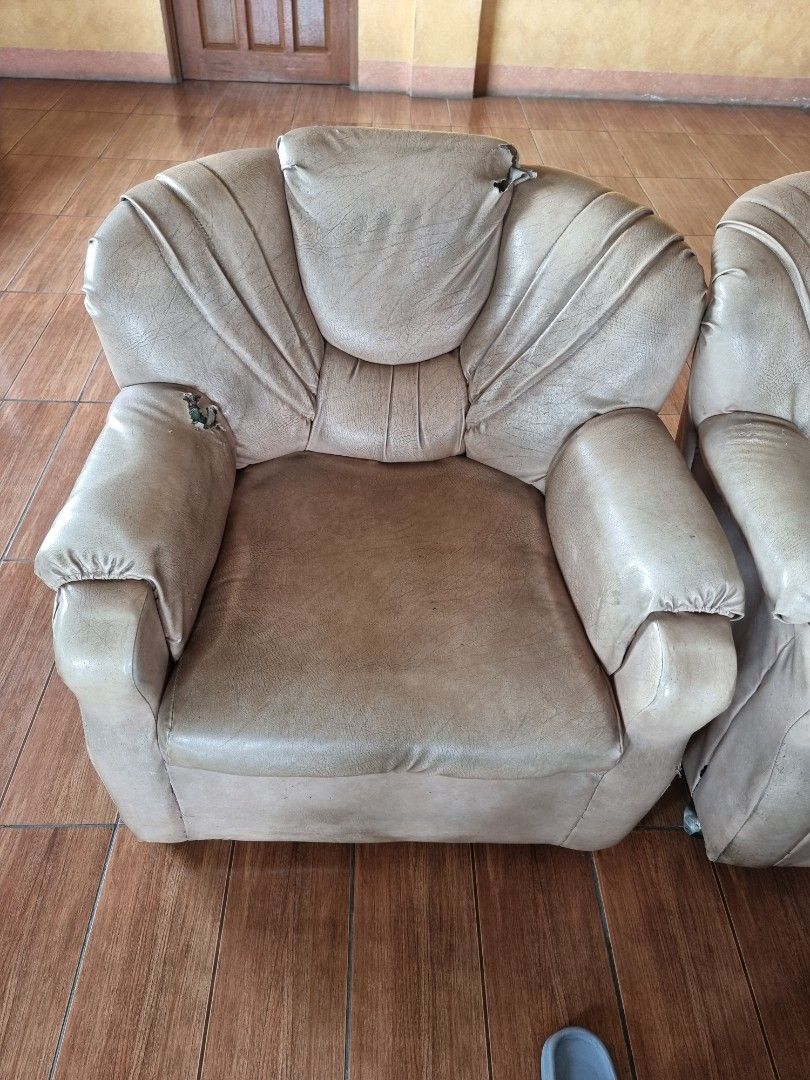 3-Seater Sofa and Armchair Set (Category: Sofas) located in Quezon City. Submitted by rl_minimalist (Listing ID 1464615852, Image 3). Description: - Comfortable sofa set: includes a 3-seater sofa and a matching armchair. - Upholstered in a light beige fabric. - Armchair shows some wear and tear, as pictured. - Still in good, usable condition with plenty of life left. - Ideal for living rooms or lounge areas..
