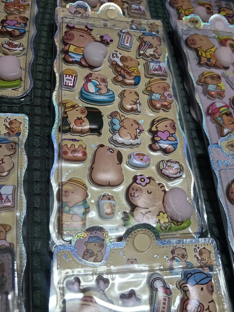 55each Cute Capybara 3D Puffy Stickers (Category: Designer & Blind Box Toys) located in Rizal. Submitted by gkstcenit (Listing ID 1464692101, Image 3). Description: - Authentic Capybara 3D puffy stickers in original packaging - Features cute designs: swimming, music, Hawaiian shirts, and snacks - Textured surface with fun raised bubble elements - Perfect for journaling, decorating phone cases, notebooks, and scrapbooking - Multiple sheets availab