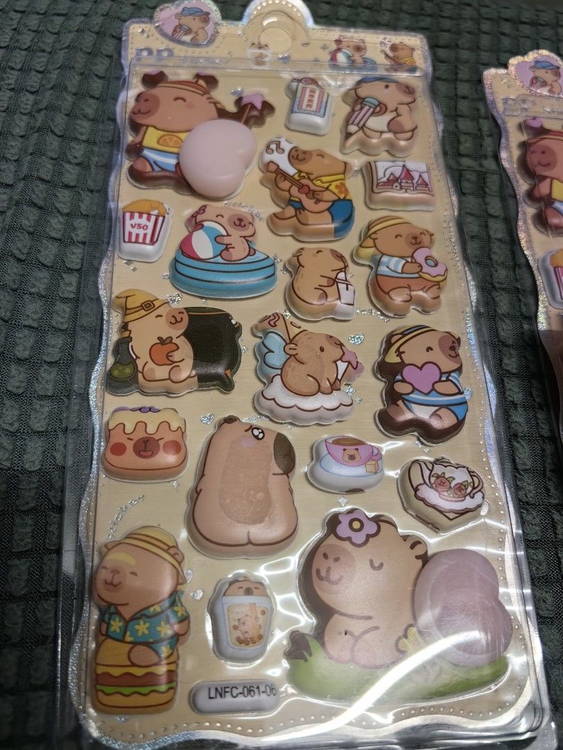 55each Cute Capybara 3D Puffy Stickers (Category: Designer & Blind Box Toys) located in Rizal. Submitted by gkstcenit (Listing ID 1464692101, Image 2). Description: - Authentic Capybara 3D puffy stickers in original packaging - Features cute designs: swimming, music, Hawaiian shirts, and snacks - Textured surface with fun raised bubble elements - Perfect for journaling, decorating phone cases, notebooks, and scrapbooking - Multiple sheets availab