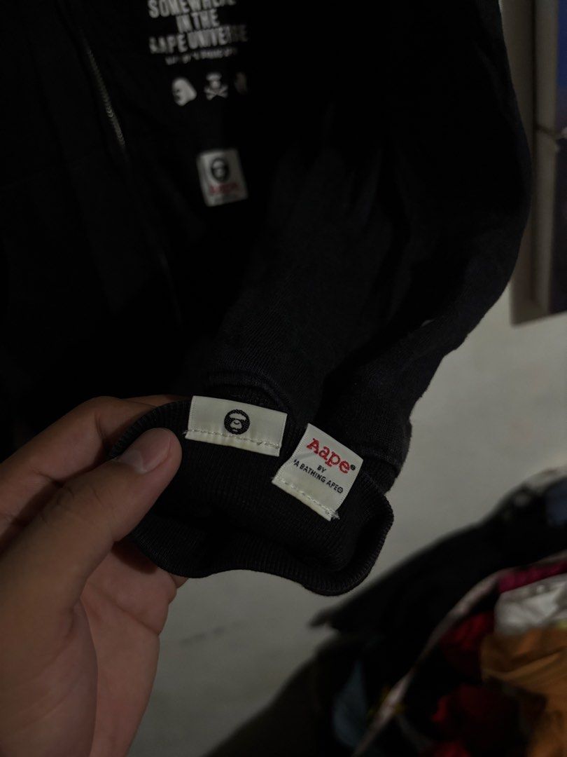 AAPE By A Bathing Ape Black Zip Hoodie (Category: Coats, Jackets and Outerwear) located in Naga. Submitted by ajrc.shop (Listing ID 1464695987, Image 3). Description: Aape Universe hoodie ✅Size: S ✅Width: 19 ✅Length: 25 ✅Color Rate: 9/10 ✅Issue: Last pic ✅Need Wash ✅Location: Bicol Naga City, Camarines Sur ✅Courier: J&T Express/Flash Express ✅MOP: Gcash only.