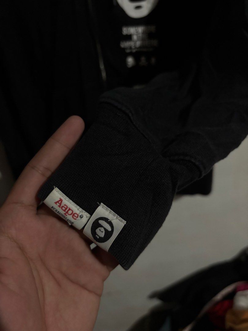 AAPE By A Bathing Ape Black Zip Hoodie (Category: Coats, Jackets and Outerwear) located in Naga. Submitted by ajrc.shop (Listing ID 1464695987, Image 2). Description: Aape Universe hoodie ✅Size: S ✅Width: 19 ✅Length: 25 ✅Color Rate: 9/10 ✅Issue: Last pic ✅Need Wash ✅Location: Bicol Naga City, Camarines Sur ✅Courier: J&T Express/Flash Express ✅MOP: Gcash only.