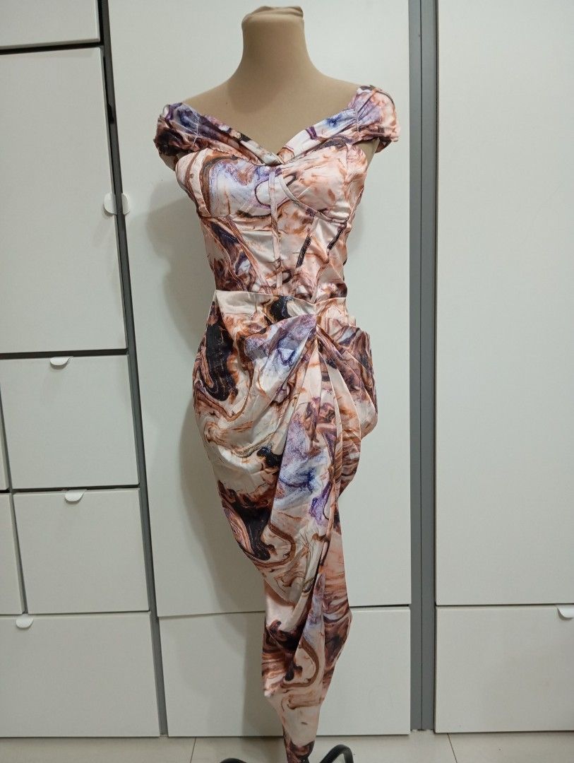 Abstract Marble Print Off-Shoulder Midi Dress (Category: Dresses) located in San Juan City. Submitted by maias.secret (Listing ID 1464702339, Image 1). Description: - Abstract marble pattern in peach, brown, and purple - Off-shoulder neckline with elegant draped cap sleeves - Fitted bodice with built-in structured boning for support - Asymmetrical gathered front drape with a chic wrapped skirt effect - Convenient and secure back zipper closure -C