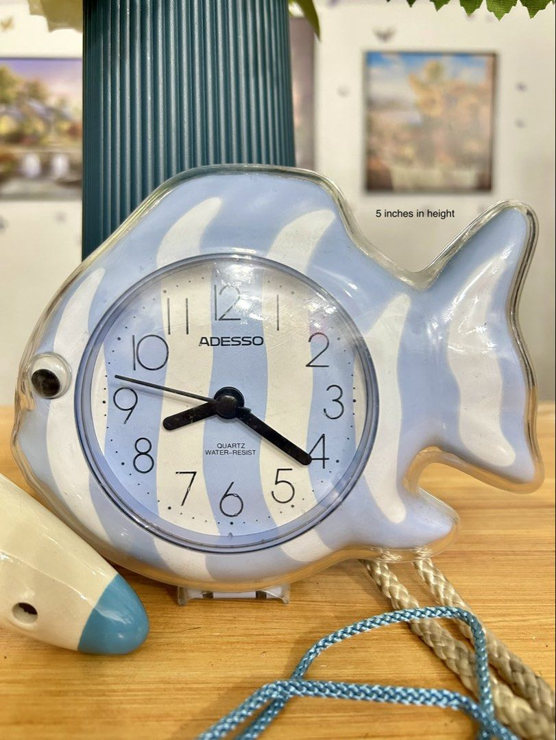 ADESSO Fish-Shaped Bathroom Clock & Ocarina (Category: Clocks) located in Bustos. Submitted by gthings.collectibles (Listing ID 1464674120, Image 2). Description: ✨ TAKE ALL / BUNDLE FOR SALE (As-Is) ✨Looking for unique aesthetic room decor ?Get these two eye-catching items for a very low bundle price! Take all for ₱380 only!! 1. ADESSO Fish-Shaped Bathroom Clock 🐠 Condition: NOT WORKING (Selling AS-IS). Note: Super cute retro light blue tropica