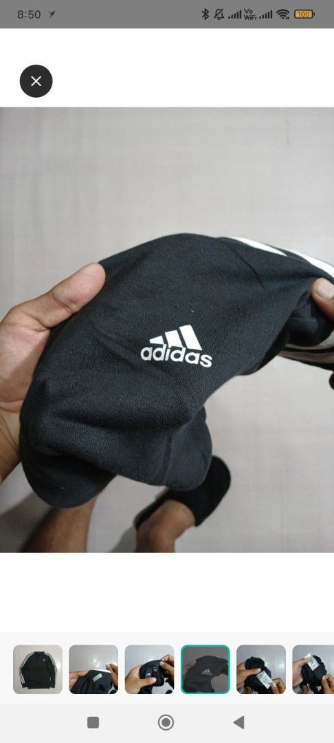 Adidas 3-Stripes Crewneck Sweatshirt (Category: Coats, Jackets and Outerwear) located in Taytay. Submitted by misspol (Listing ID 1464573623, Image 2). Description: - Classic black Adidas sweatshirt - Iconic 3-stripes on sleeves - Comfortable crewneck design - Features Adidas logo on chest - Versatile for casual wear or workouts - Tag indicates size 20 & 27.