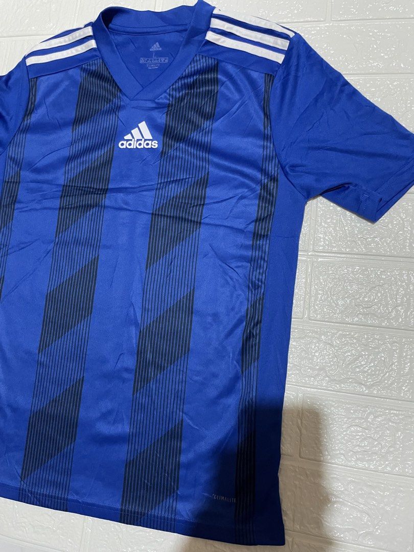 Adidas Climalite Football Training Jersey Tee (Category: Activewear) located in Marilao. Submitted by clear_out_closet (Listing ID 1464662976, Image 3). Description: Item Details: 👇 • Brand: Adidas • Technology / Product Line: Climalite (engineered moisture-wicking soccer/football training fabric) • Color: Royal Blue with Black Vertical Gradient Stripe Accents and White Shoulders/Stripes • Material: Main Material: 100% Polyester (Recycled) • Cou