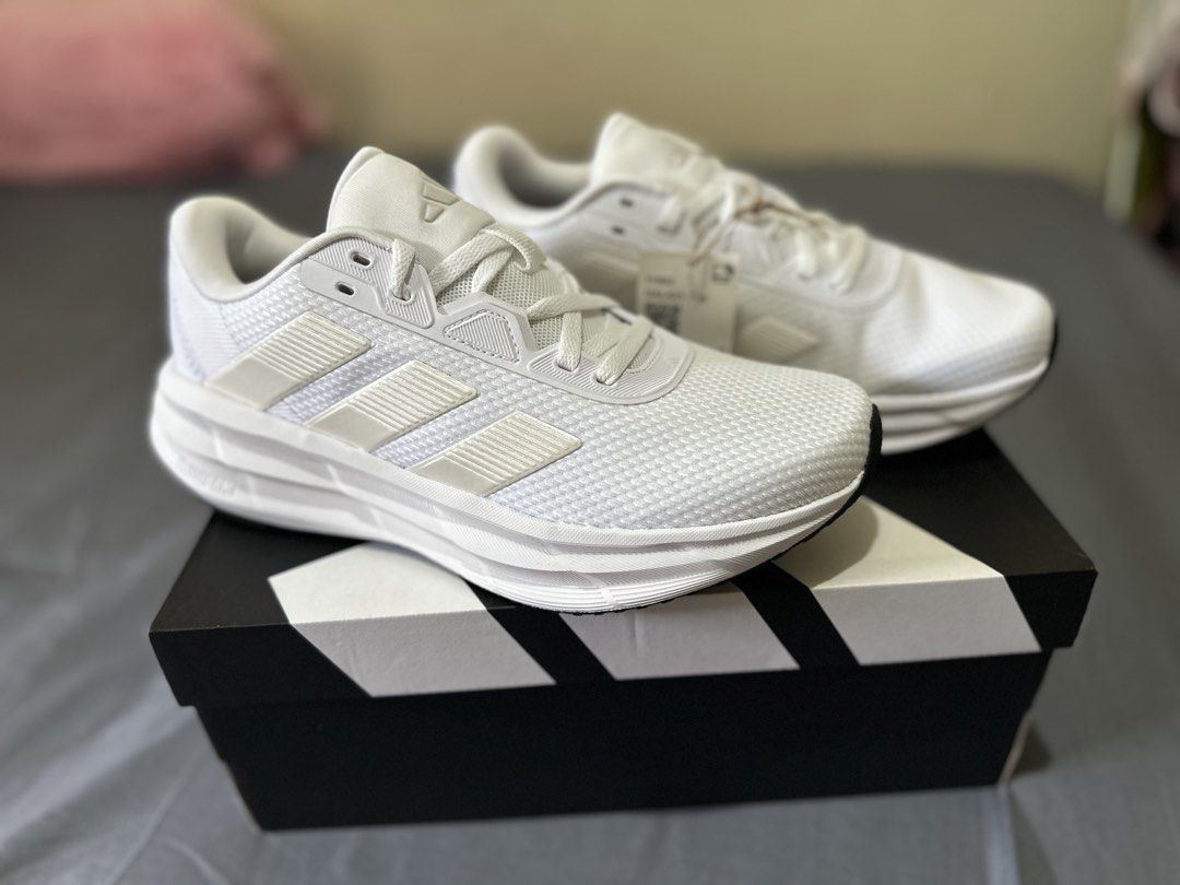 Adidas Galaxy 7W Running Shoes White (Category: Sneakers) located in Manila. Submitted by boldtiger_0f837b (Listing ID 1464582528, Image 1). Description: - White Adidas running shoes - Classic three stripes design - Cloudfoam cushioning for ultimate comfort - Ideal for running and everyday wear - Comes with original box - Size: US 700.