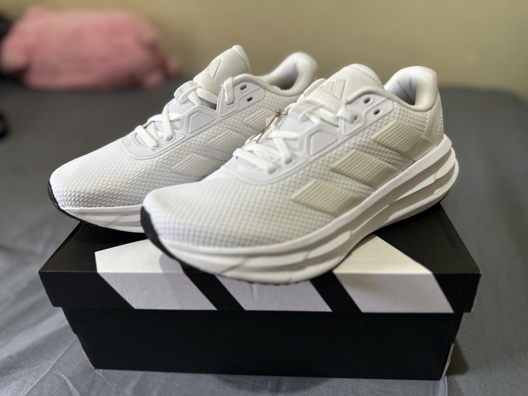 Adidas Galaxy 7W Running Shoes White (Category: Sneakers) located in Manila. Submitted by boldtiger_0f837b (Listing ID 1464582528, Image 2). Description: - White Adidas running shoes - Classic three stripes design - Cloudfoam cushioning for ultimate comfort - Ideal for running and everyday wear - Comes with original box - Size: US 700.