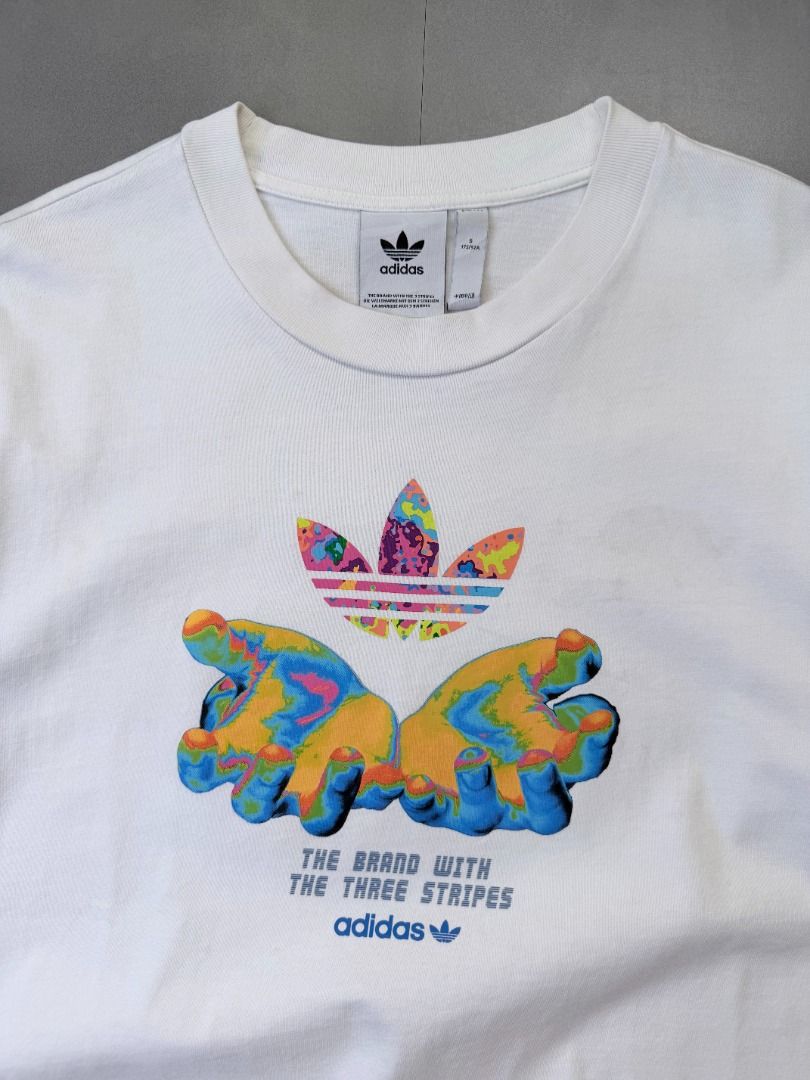Adidas Graphic tee shirt (Category: Tshirts & Polo Shirts ) located in Cabanatuan. Submitted by argarments.ph (Listing ID 1464634577, Image 2). Description: Tagged: Small on tag, fits medium Width 21.5" | Length 28.5" Condition: Great condition Issue(s): Small dirt stain. see photos.