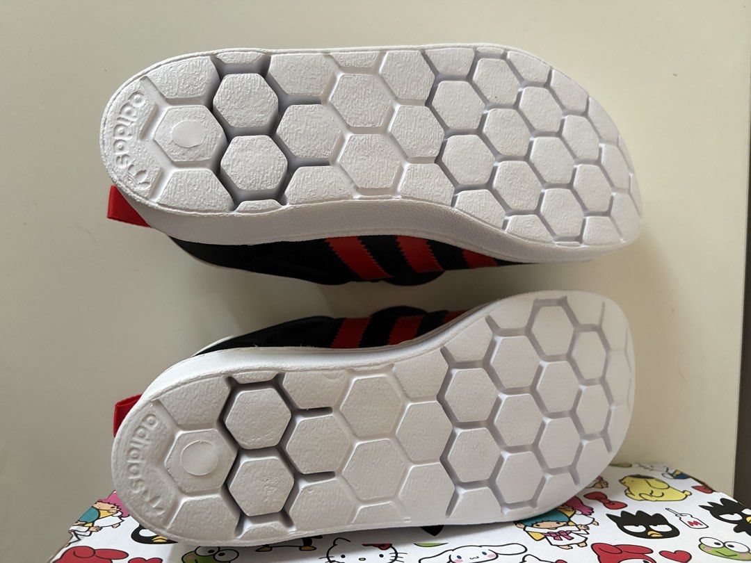 Adidas Superstar 360 Hello Kitty and Friends (Category: Babies & Kids Fashion) located in Pasig City. Submitted by jackiedla (Listing ID 1464765683, Image 2). Description: - Brand: Adidas Superstar x Kitty and Friends - Colorway: Core Black and Vivid Red - Size: Kids US 1.5 / UK 1 / French 33 - Design: Iconic shell toe with oversized Kitty face patches and hexagonal outsoles - Condition: Complete with original character-printed shoebox - Perfect 