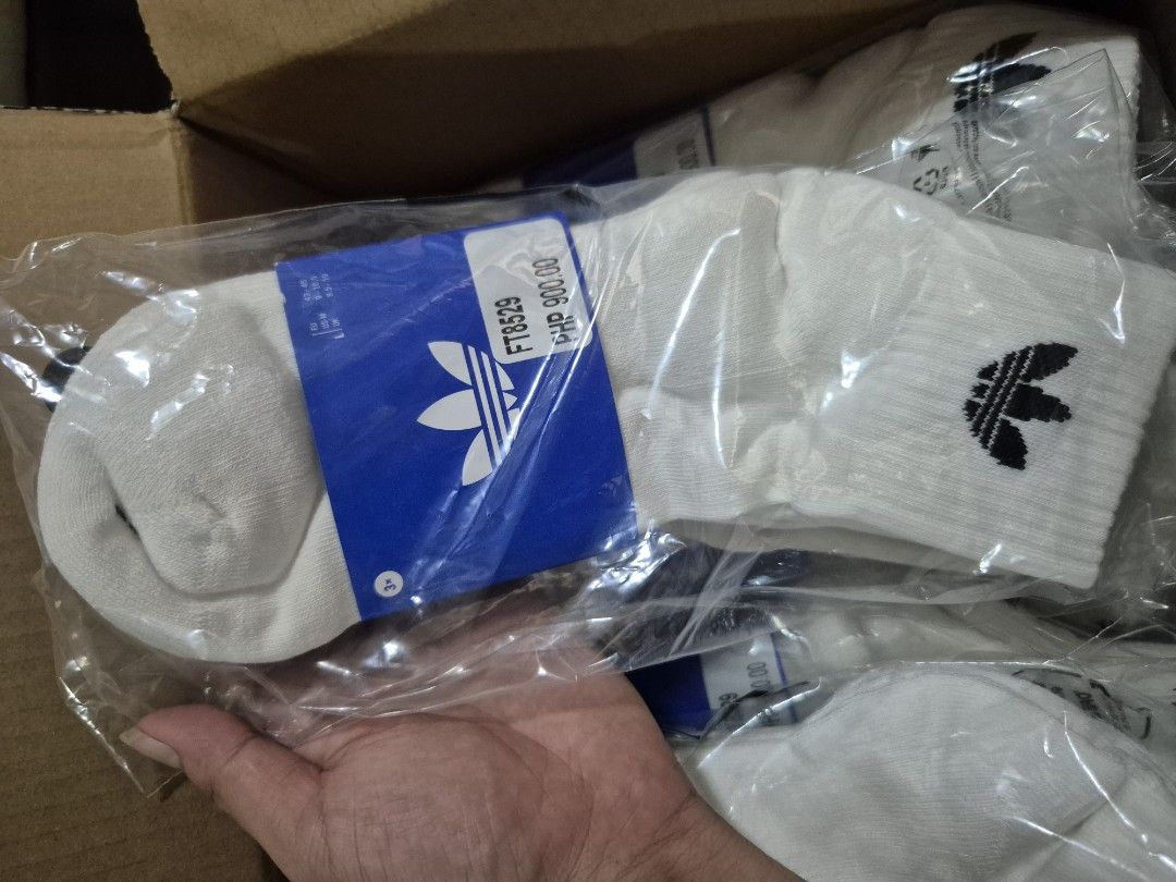 Adidas White Socks FT8529 3 Pairs (Category: Socks) located in Manila. Submitted by jayveecatu14021 (Listing ID 1464632921, Image 2). Description: - Pack of 3 Adidas white ankle socks - Model: FT8529 - Features classic Adidas trefoil logo - Made with 100% recycled bag material - Ideal for everyday wear - Comfortable and stylish.