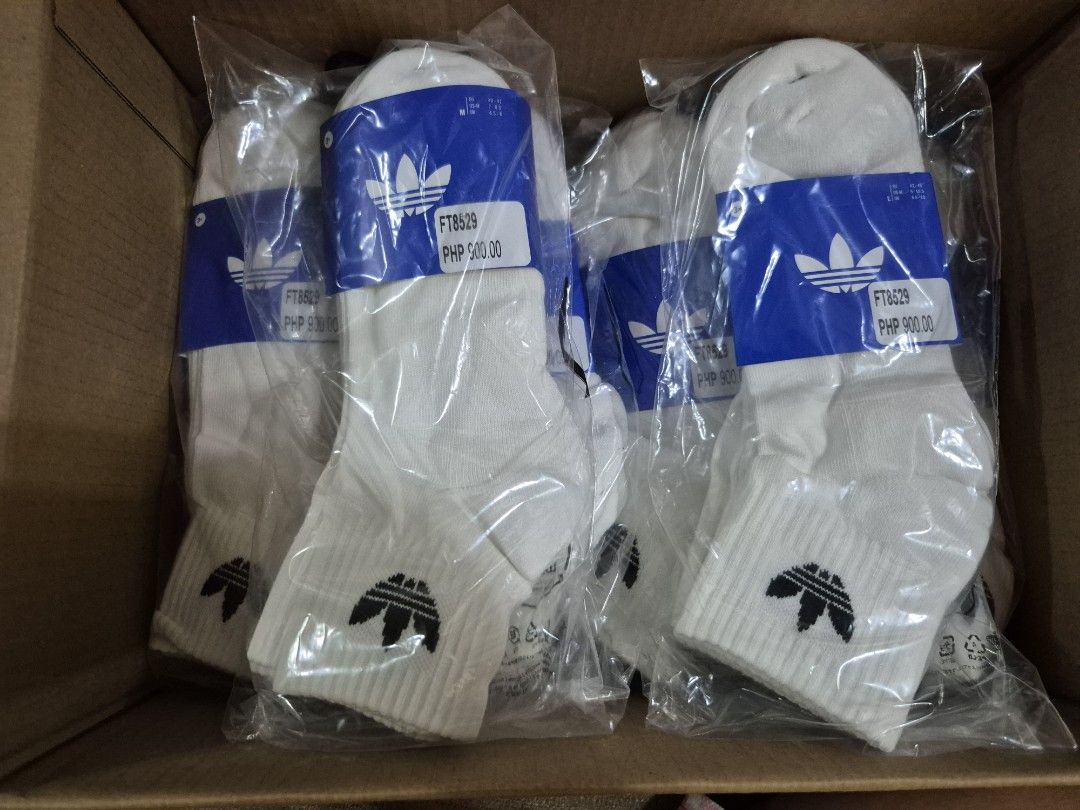 Adidas White Socks FT8529 3 Pairs (Category: Socks) located in Manila. Submitted by jayveecatu14021 (Listing ID 1464632921, Image 1). Description: - Pack of 3 Adidas white ankle socks - Model: FT8529 - Features classic Adidas trefoil logo - Made with 100% recycled bag material - Ideal for everyday wear - Comfortable and stylish.