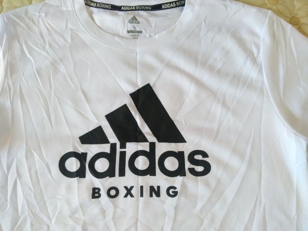 Adidas White T-shirt Small (Category: Tshirts & Polo Shirts ) located in Zamboanga. Submitted by zhumhazhav (Listing ID 1464672432, Image 2). Description: Tag size small Width 18 Length 26.5 White color way Dry fit cloth Excellent condition Color rate 9.8/10 Check all photos for details 400+shipping fee.