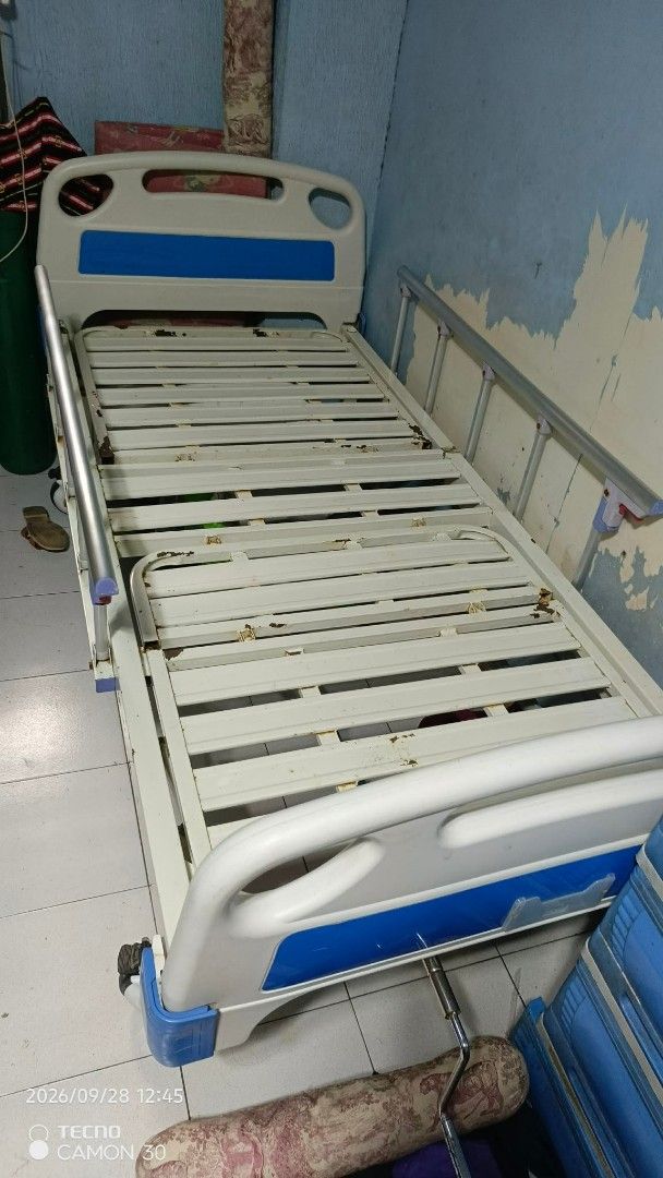 Adjustable Hospital Bed with Side Rails and Walker (Category: Medical Supplies & Tools) located in Valenzuela. Submitted by thrift_ko_cedie222 (Listing ID 1464605732, Image 1). Description: - Hospital bed with adjustable side rails - Includes walker with seat and wheels - Bed frame: Metal with blue and white accents - Walker: Chrome-plated metal - Ideal for home care needs - Selling as a complete set.