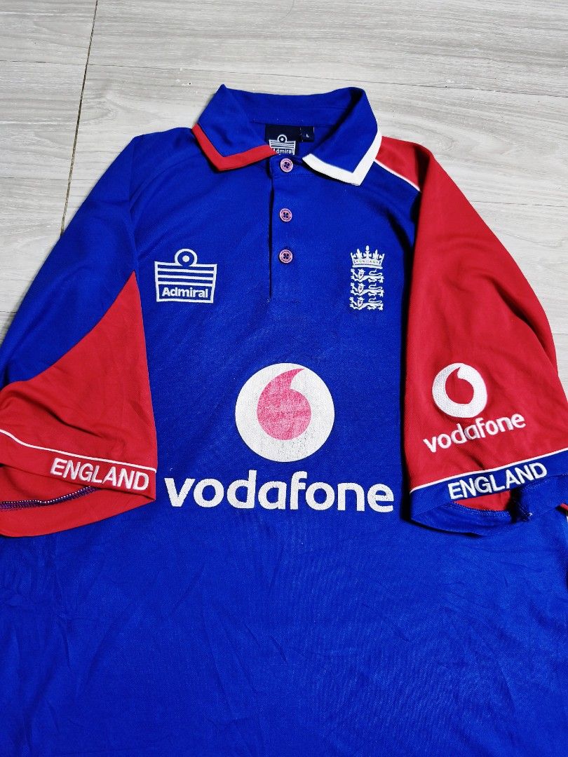Admiral England Jersey Vodafone Admiral (Category: Activewear) located in Paranaque City. Submitted by pickersform (Listing ID 1464676255, Image 2). Description: - Authentic England Admiral Jersey Vodafone - Features ECB Logo - Size: Large can do XL dimes 24x31 - Design: Red and blue with 'England' text on sleeves - Ideal for any passionate England Admiral supporter check pics for details .