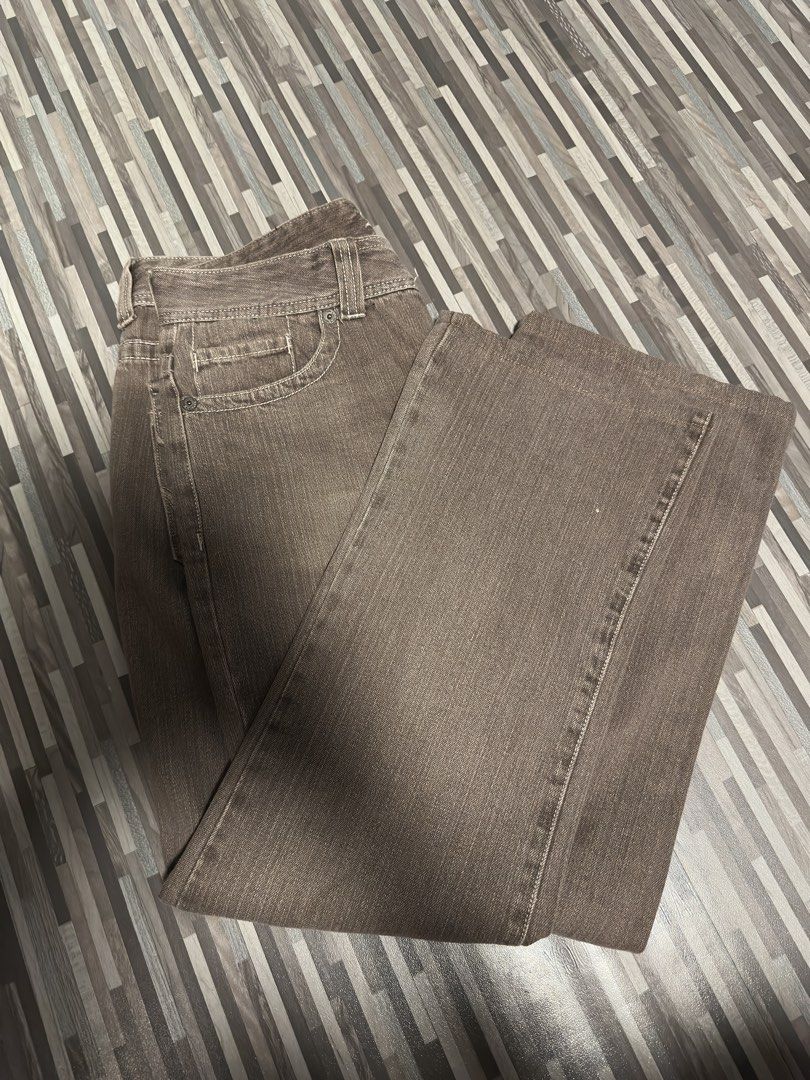 AK Jeans Brown Flare Jeans (Category: Jeans) located in Manila. Submitted by miguelcajucs (Listing ID 1464611866, Image 3). Description: - Brand: AK Jeans - Style: Brown Flare Jeans - Size: 34 waist, 40 length, 9.5 leg opening - Features: Classic five-pocket styling, button and zip closure - Material: Denim with a slight wash - Versatile: Great for casual wear or dressing up.