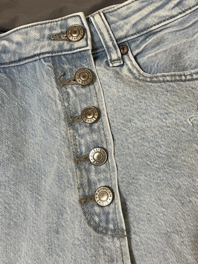 American Eagle Distressed Button-Front Denim Shorts (Category: Shorts) located in Taguig. Submitted by lovestoreph (Listing ID 1464712881, Image 3). Description: Light wash denim skort from American Eagle. High-waisted style with a button-fly front. Trendy distressed details with frayed rips on the front. Classic five-pocket design plus belt loops. Super cute and easy to throw on with a simple tee or tank top for summer days..