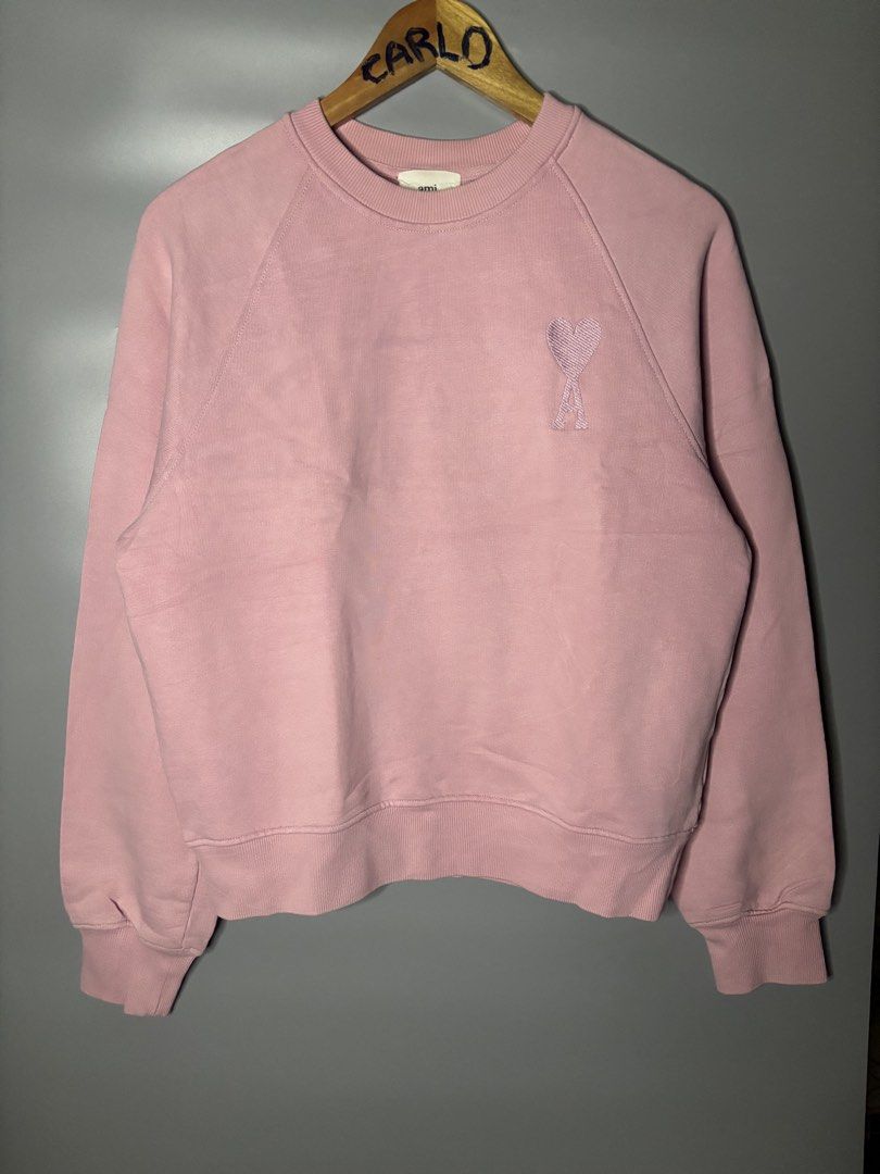 AMI PARIS AMI DE COEUR (Category: Coats, Jackets and Outerwear) located in Bayambang. Submitted by lo_keythrifting (Listing ID 1464603813, Image 1). Description: - AMI Paris Sweatshirt - Condition: Good as new - Dimes: 21*24 - Color rate: 10/10 - No issue - Signature Ami de Coeur logo embroidered on chest - Crewneck with raglan sleeves - Made in Portugal - Size: Medium (M) - Ideal for casual wear MOP: GCASH COURIER: J&T.