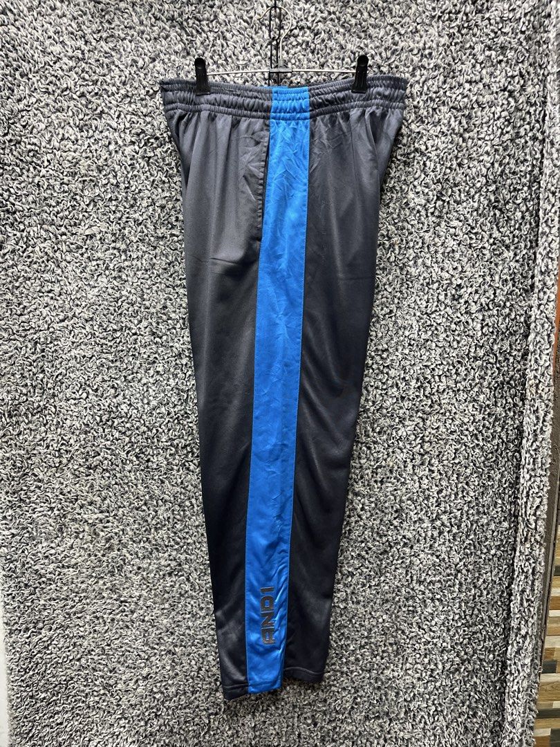 AND1 Men's Athletic Track Pants | Size M (Category: Joggers) located in General Trias. Submitted by zrchustle.604 (Listing ID 1464623687, Image 1). Description: AND1 Men's Athletic Track Pants featuring a charcoal/black colorway with a distinct bright blue side stripe. Key Features • Brand Detail: The iconic AND1 wordmark logo is embroidered vertically near the bottom ankle cuff of the blue stripe. • Design & Comfort: Made with a smooth athletic 