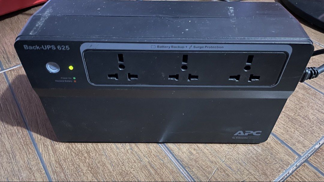 APC Back-UPS 650 Uninterruptible Power Supply (Category: Electrical, Adaptors & Sockets) located in Antipolo. Submitted by tatayjq (Listing ID 1464695674, Image 1). Description: - Brand: APC Back-UPS 650 - Condition: Working perfectly, has some exterior dust from storage - Features: Universal power sockets on the front panel - Controls: Push-button power switch with green status indicator light - Design: Standard black desktop tower housing - Ide