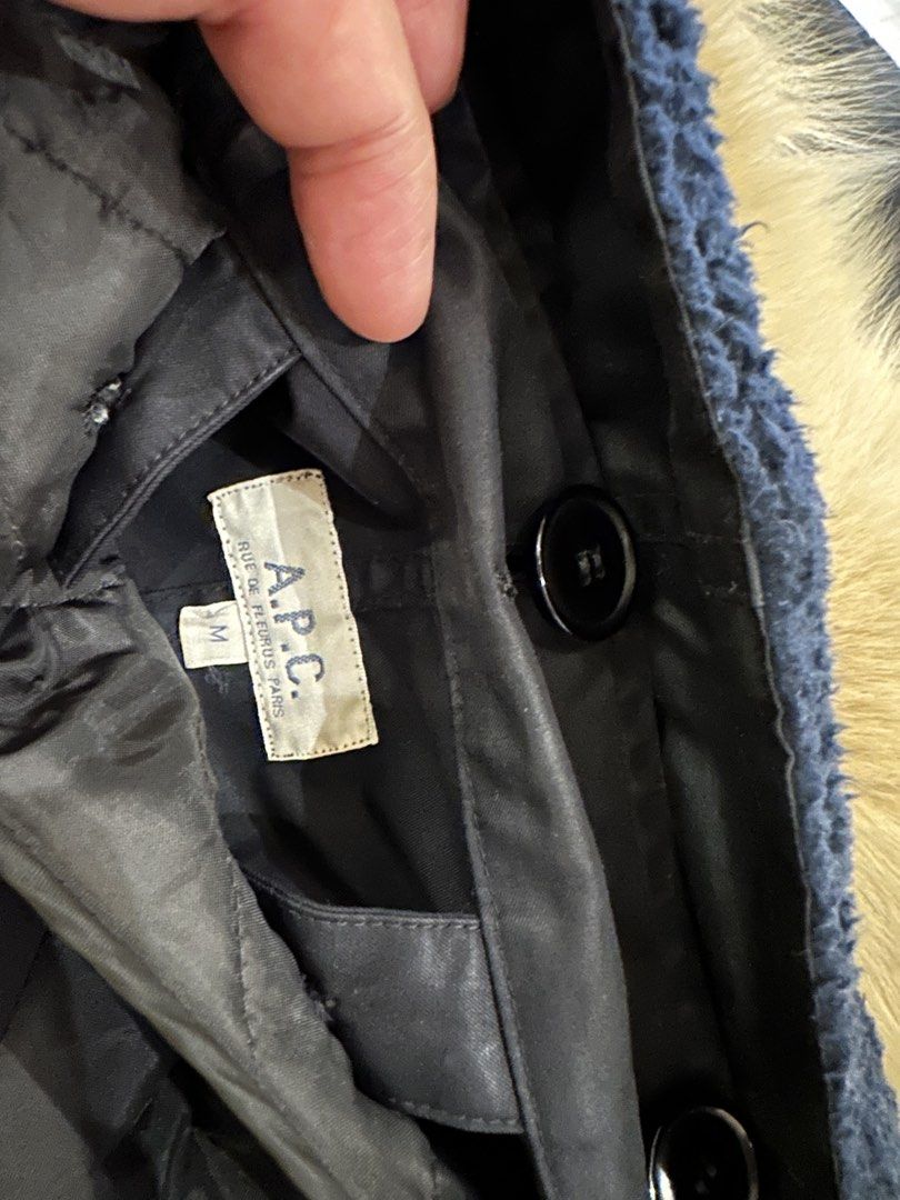 A.P.C. Fur Hooded Parka Jacket Coat (Category: Coats, Jackets and Outerwear) located in Makati City. Submitted by victorvillareal (Listing ID 1464708763, Image 3). Description: - Brand: A.P.C. - Size: Medium - Color: Black - Lining: Quilted interior with blue sherpa fleece - Hood: Large hood with faux fur trim - Closure: Front zipper and button - Pockets: Convenient flap pockets - Fit: Adjustable drawstring waist - Condition: Good winter piece to