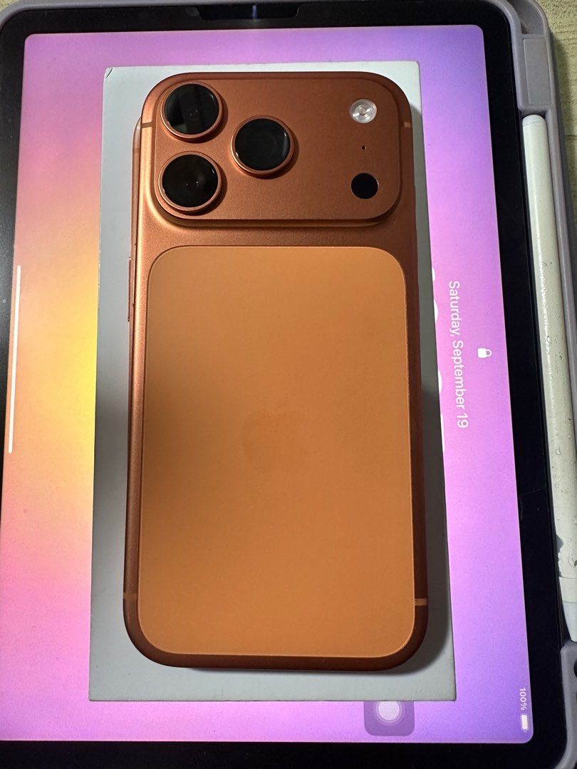 Apple iPhone (Category: iPhone 17 Series) located in Manila. Submitted by jbuckets (Listing ID 1464688247, Image 1). Description: -Smartlocked - Color: Stunning orange bronze body - Camera: Versatile triple camera setup - Battery Health: 98% (235 cycle counts) - Condition: Clean screen with no cracks, immaculate edges all around - Status: 100% fully functional and ready for daily use.
