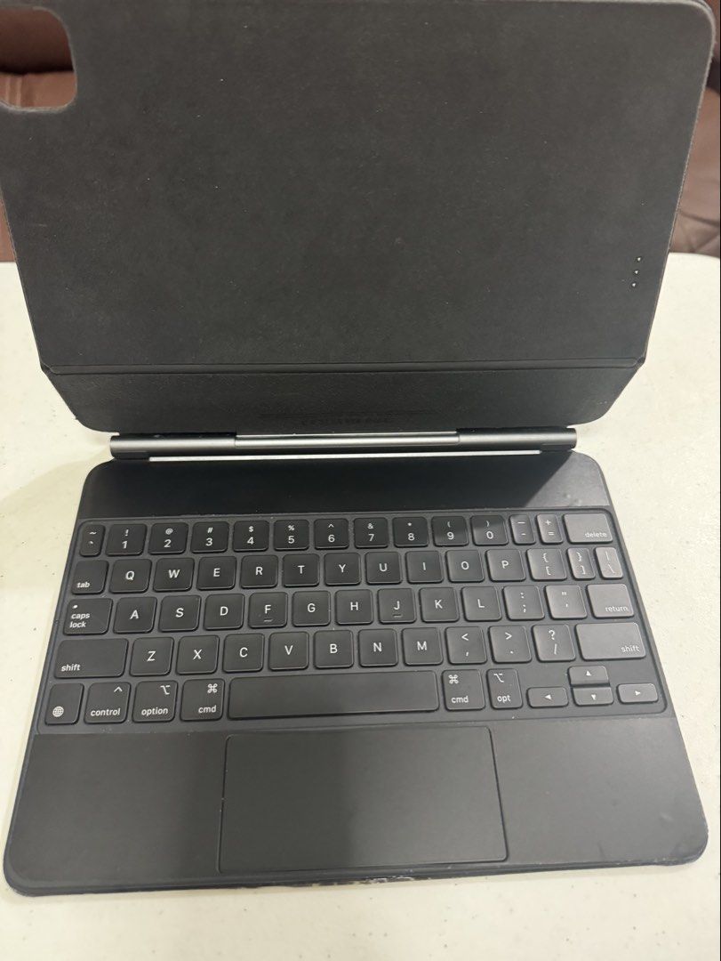 Apple Magic Keyboard for iPad Pro (Category: Computer Keyboard) located in Quezon City. Submitted by james.mrco (Listing ID 1462331042, Image 1). Description: FOR SALE ONLY SLIGHTLY USED APPLE IPAD MAGIC KEYBOARD 11 INCH Black color, All Keys Working, Serial Number posted, Actual Photos posted. With dbrand Skin installed. Compatible with iPad Pro Gen 1,2, 3rd, 4th Gen IPad Air 4th, 5th, M2 and m3. NO MORE BOX, Check all you want upon meet up, No 