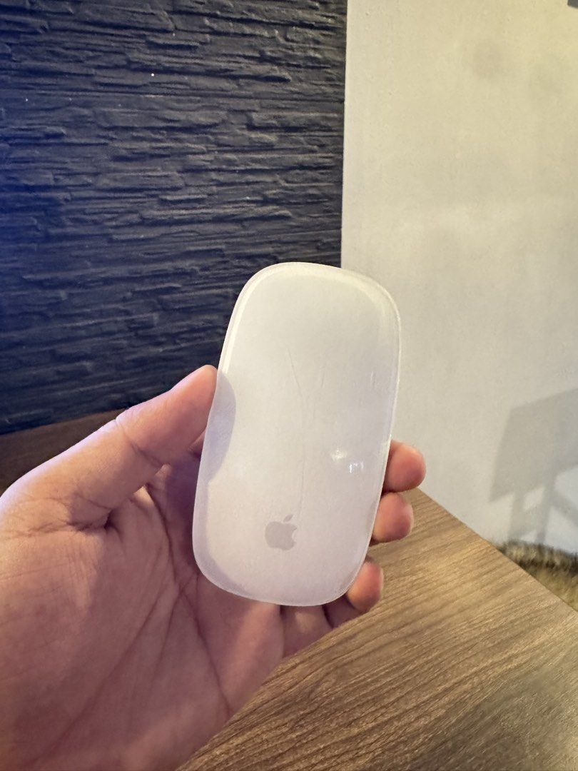 Apple Magic Mouse (A1657) (Category: Mouse & Mousepads) located in Taguig. Submitted by jhnlndllcndn (Listing ID 1464680785, Image 1). Description: - Apple Magic Mouse (A1657) - Color: White top with Apple logo, Silver bottom - Condition: Works great.