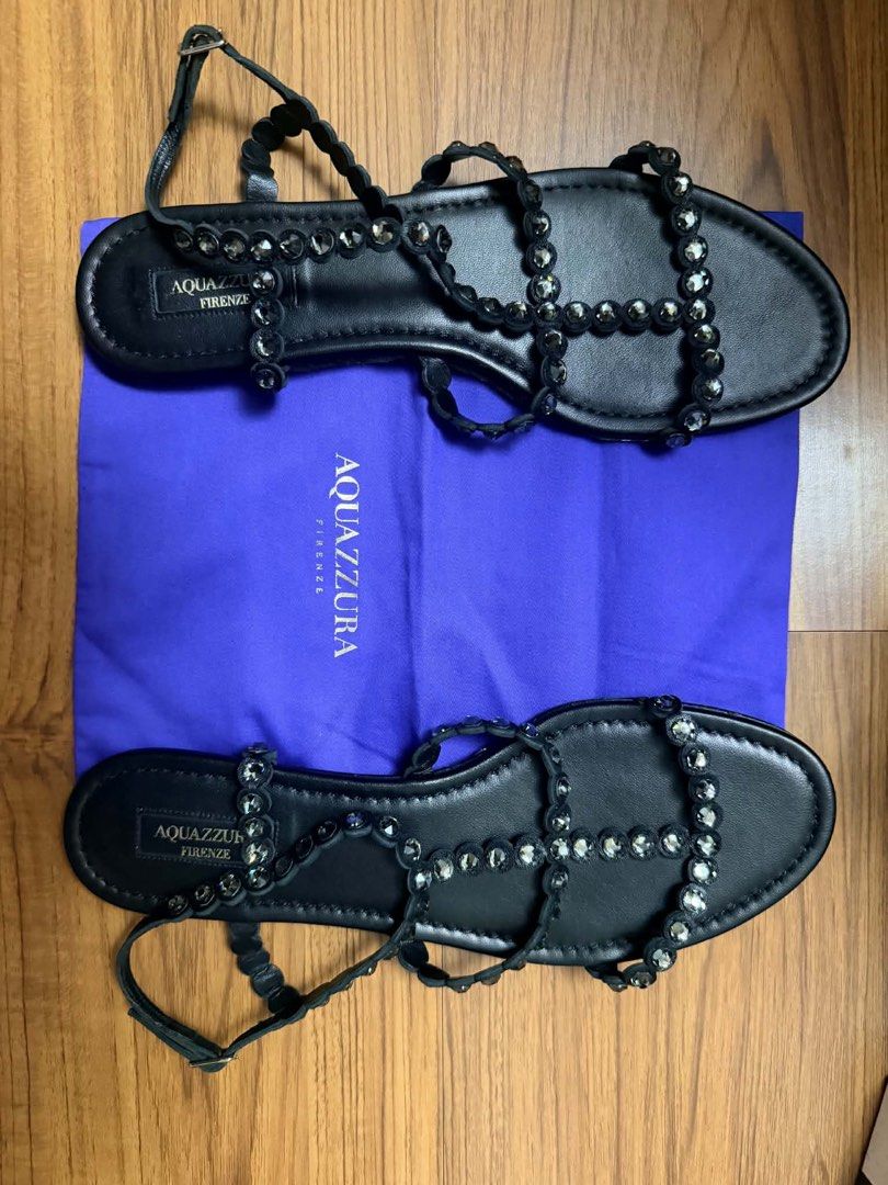 Aquazzura Tequila Sandals (Category: Flats & Sandals) located in Marikina City. Submitted by mommymishy (Listing ID 1464762066, Image 2). Description: - Brand: Aquazzura - Style: Tequila Flat Sandals - Color: Black - Material: Nappa leather with crystal embellishments - Size: EU 40 - Closure: Ankle buckle - Inclusions: Original purple dust bag and box - Provenance: Purchased from Rustan's (100% authentic).