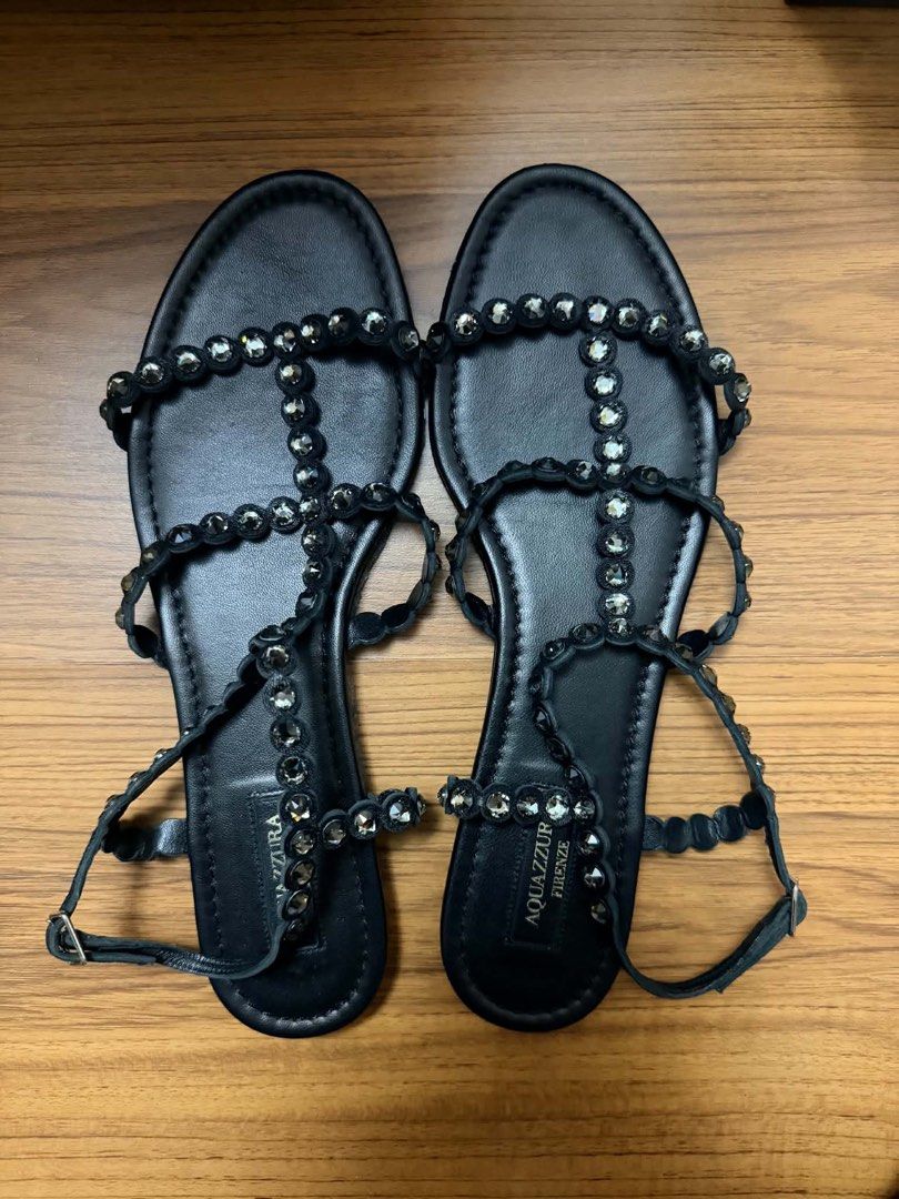 Aquazzura Tequila Sandals (Category: Flats & Sandals) located in Marikina City. Submitted by mommymishy (Listing ID 1464762066, Image 1). Description: - Brand: Aquazzura - Style: Tequila Flat Sandals - Color: Black - Material: Nappa leather with crystal embellishments - Size: EU 40 - Closure: Ankle buckle - Inclusions: Original purple dust bag and box - Provenance: Purchased from Rustan's (100% authentic).