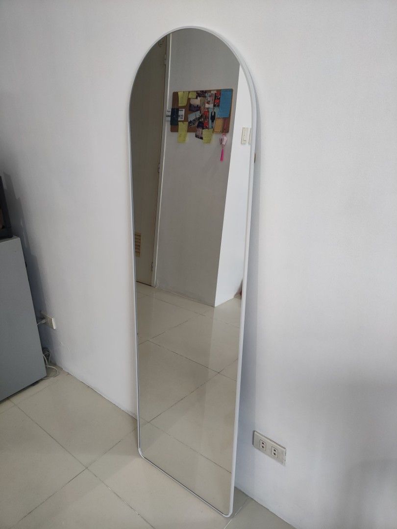 Arched Full Length Mirror in White (Category: Mirrors) located in Quezon City. Submitted by maxsab (Listing ID 1464665988, Image 2). Description: - Tall arched mirror. Comes with stand - Simple white frame - Ideal for outfit checks - Fits any room decor - Easy to move around - Perfect for bedrooms or hallways - Size: 63 in x 18.5 in.