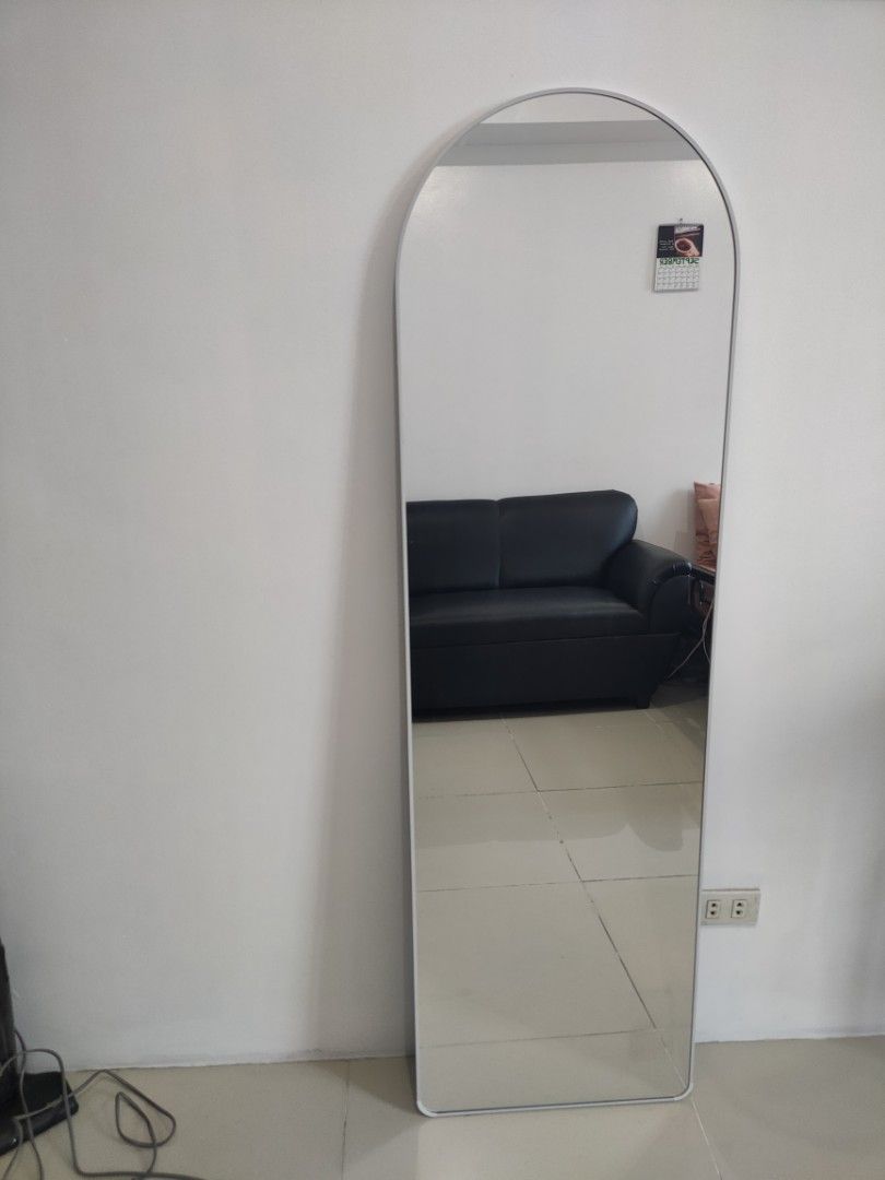 Arched Full Length Mirror in White (Category: Mirrors) located in Quezon City. Submitted by maxsab (Listing ID 1464665988, Image 1). Description: - Tall arched mirror. Comes with stand - Simple white frame - Ideal for outfit checks - Fits any room decor - Easy to move around - Perfect for bedrooms or hallways - Size: 63 in x 18.5 in.