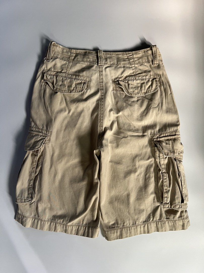 Arizona Khaki Cargo Shorts Size 29 (Category: Shorts) located in Baler. Submitted by allthrifted31 (Listing ID 1464732533, Image 2). Description: - Brand/Item: Arizona Khaki Cargo Shorts - Size: 29 - Material: 100% Cotton (Made in Bangladesh) - Design: Multiple pockets on front, back, and sides with olive green waistband lining - Condition: Good, with a small stain near the front belt loop (please check close-up photo).