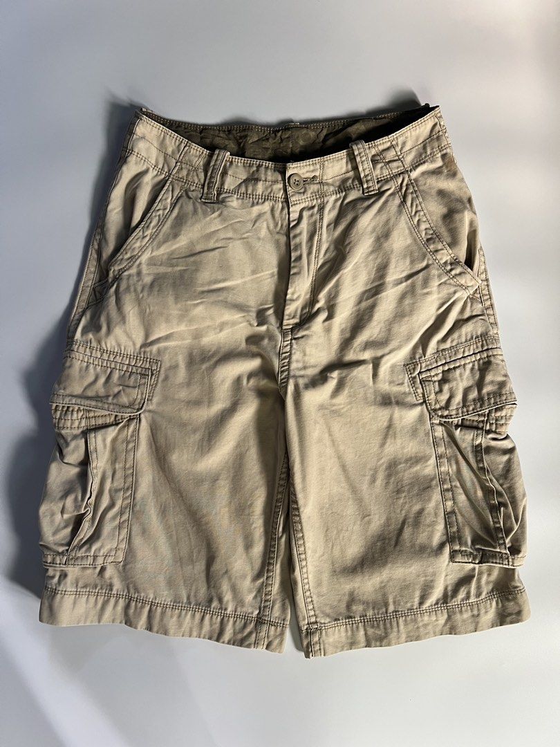 Arizona Khaki Cargo Shorts Size 29 (Category: Shorts) located in Baler. Submitted by allthrifted31 (Listing ID 1464732533, Image 1). Description: - Brand/Item: Arizona Khaki Cargo Shorts - Size: 29 - Material: 100% Cotton (Made in Bangladesh) - Design: Multiple pockets on front, back, and sides with olive green waistband lining - Condition: Good, with a small stain near the front belt loop (please check close-up photo).