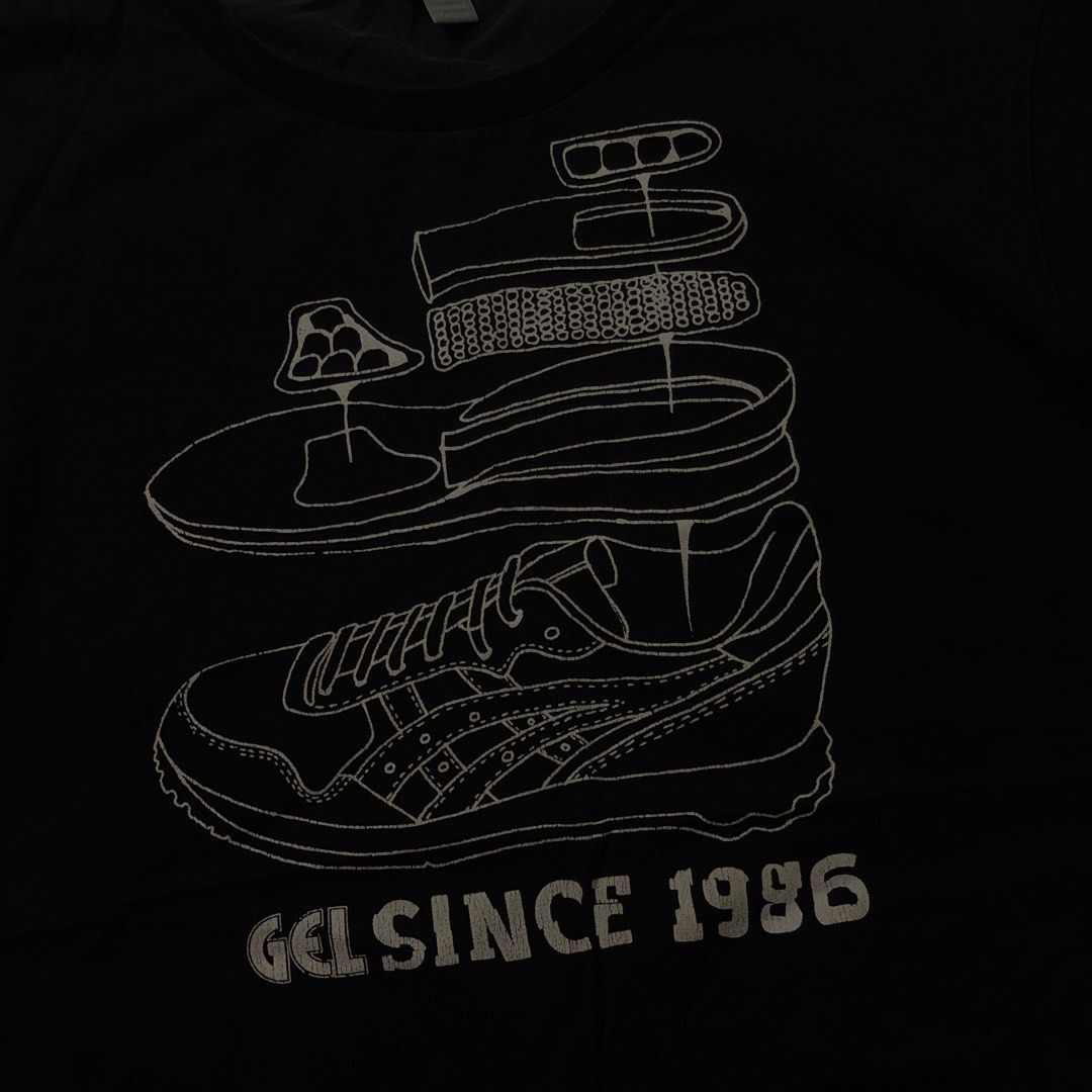 Asics Gel Since 1986 Black Graphic Tee (Category: Activewear) located in Manila. Submitted by johnedel_james (Listing ID 1464697350, Image 3). Description: - Brand: Asics - Color: Black - Design: Large sneaker teardown graphic with 'GEL SINCE 1986' on chest, small Asics logo near hem - Fit: Regular fit, crew neck, short sleeves - Style: Casual streetwear, perfect for sneaker fans - Condition: Good as new / Excellent.