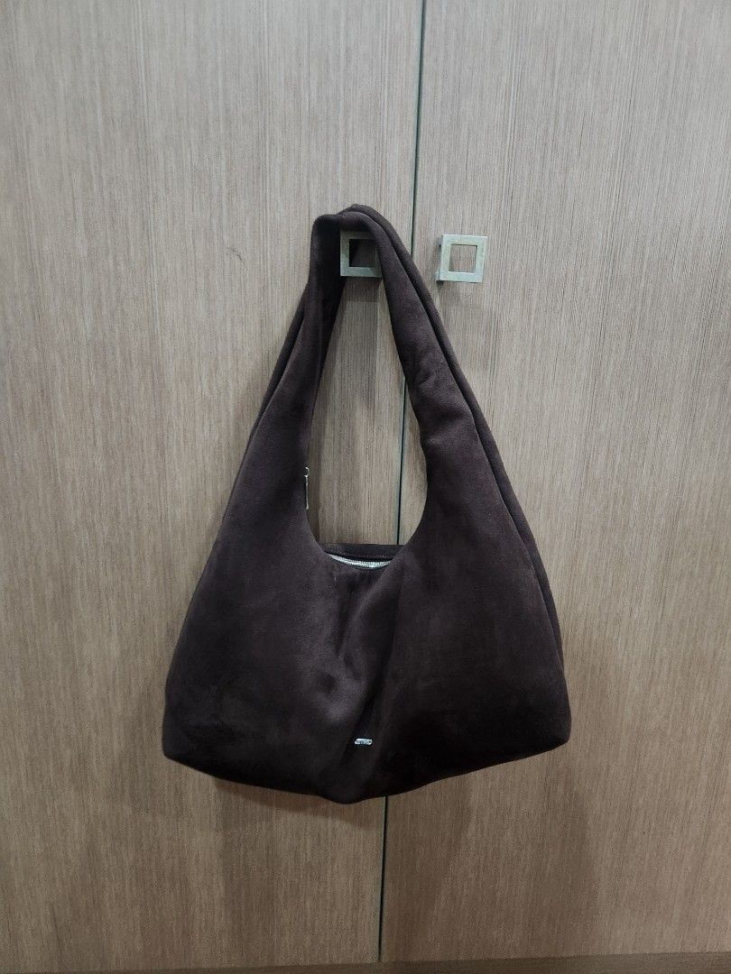 Astrid Brown Suede Shoulder Bag (Category: Shoulder Bags) located in Makati City. Submitted by bargain_hunt (Listing ID 1464645091, Image 1). Description: - Dark brown suede shoulder bag - Zipper closure - Internal pocket - Simple and chic design - Ideal for everyday use - Fits your essentials minimal flaw on the logo .