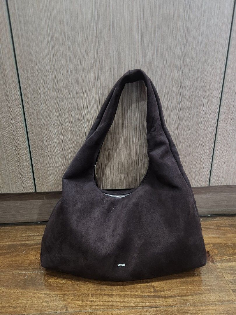 Astrid Brown Suede Shoulder Bag (Category: Shoulder Bags) located in Makati City. Submitted by bargain_hunt (Listing ID 1464645091, Image 2). Description: - Dark brown suede shoulder bag - Zipper closure - Internal pocket - Simple and chic design - Ideal for everyday use - Fits your essentials minimal flaw on the logo .