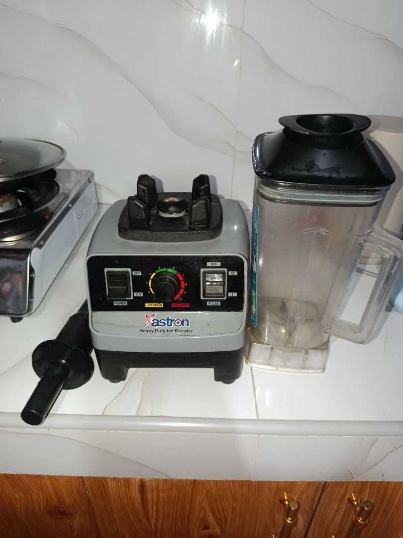 Astron Heavy Duty Ice Blender (Category: Juicers, Blenders & Grinders) located in Valenzuela. Submitted by santino06 (Listing ID 1464702788, Image 1). Description: - Brand: Astron heavy duty ice blender - Color: Stylish grey and black - Performance: Powerful motor base with variable speed control dial, power switch, and pulse switch - Inclusions: Large clear pitcher with black lid and included tamper tool - Best for: Smoothies, crushing ice, and 