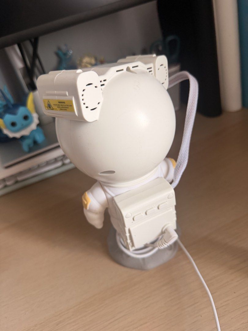 Astronaut Projector Lamp with Moon Base (Category: Lighting) located in Manila. Submitted by ellede32655 (Listing ID 1464618675, Image 2). Description: - Adorable astronaut design - Projects light - Sits on a moon-shaped base - Adjustable head for custom lighting - USB powered (cable included) - Ideal for kids' rooms or as a unique night light - In excellent working condition.