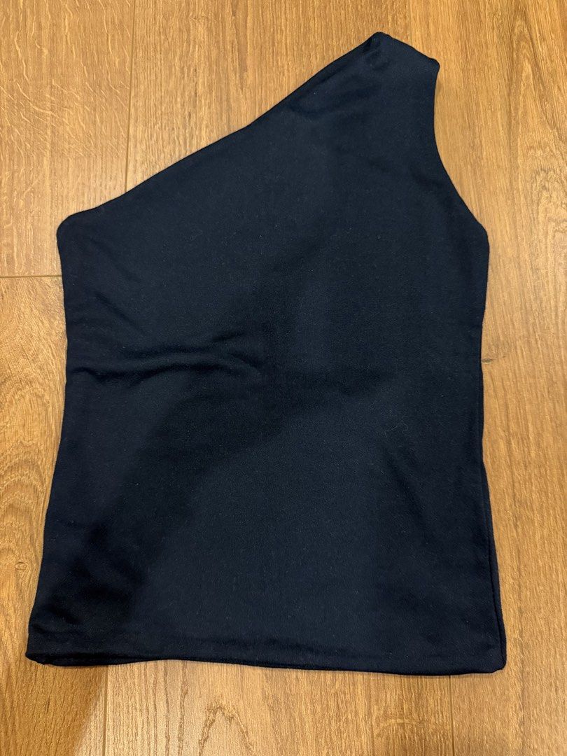 Asymmetrical navy blue sleeveless top (Category: Others Tops) located in Paranaque City. Submitted by bbyooodaa (Listing ID 1464653909, Image 2). Description: No brand trendy navy blue asymmetrical sleeveless top.