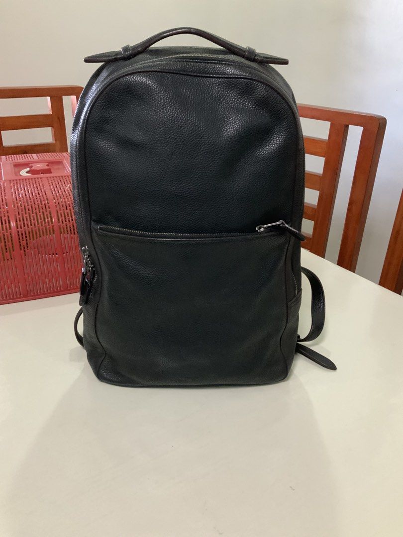 Authentic Coach Black Leather Backpack (Category: Announcements) located in San Fernando. Submitted by destinydeals04 (Listing ID 1464571569, Image 2). Description: - Original Coach Classic black leather backpack - Pebbled leather texture - Zippered front pocket - Main compartment with zipper closure - Adjustable shoulder straps - Top handle for carrying - Simple and classic design - Ideal for daily use or travel.