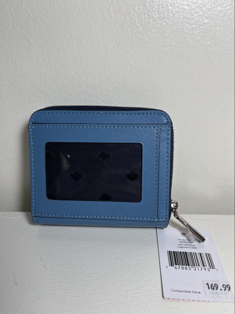 Authentic Kate Spade Staci Colorblock Small Bifold Wallet (Category: Wallets & Card holders) located in Baguio. Submitted by nailongdeclutters (Listing ID 1464620300, Image 2). Description: ⭐️Authentic Kate Spade from Canada (as seen in the tag) ⭐️Color: Blue and white ⭐ Bi-fold wallet with ID slot, card slots, and coin compartment ⭐️With tag and care booklet ⭐️Brand new condition .