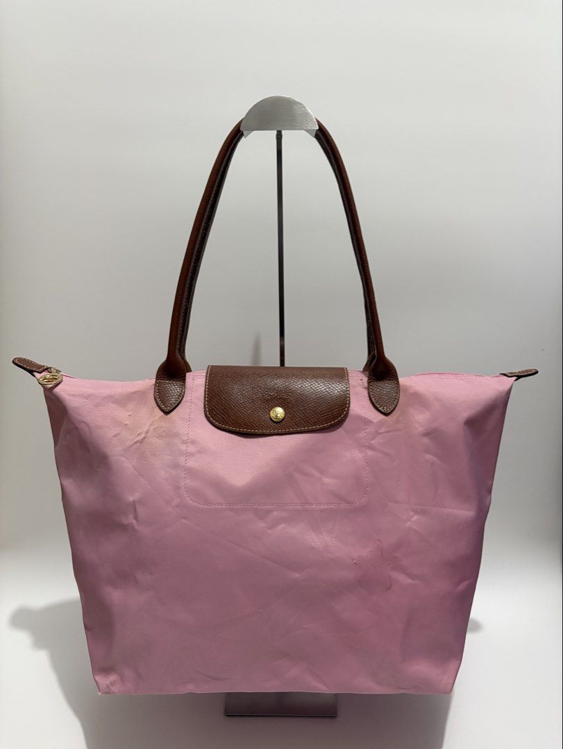 Authentic Longchamp Le Pliage Large Tote Bag (Category: Tote Bags) located in Subic. Submitted by dear.jeveaph (Listing ID 1464605307, Image 1). Description: Authentic Longchamp Le Pliage Large Long Handle - signs of use with dirt stains. See photos for reference - Needs wash - Good for everyday use Friendly reminder: This is a preloved bag. Please manage your expectations. If you want a flawless bag, buy one in the store. 😊.