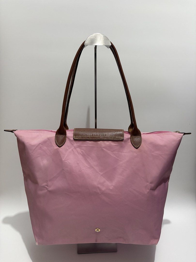 Authentic Longchamp Le Pliage Large Tote Bag (Category: Tote Bags) located in Subic. Submitted by dear.jeveaph (Listing ID 1464605307, Image 2). Description: Authentic Longchamp Le Pliage Large Long Handle - signs of use with dirt stains. See photos for reference - Needs wash - Good for everyday use Friendly reminder: This is a preloved bag. Please manage your expectations. If you want a flawless bag, buy one in the store. 😊.