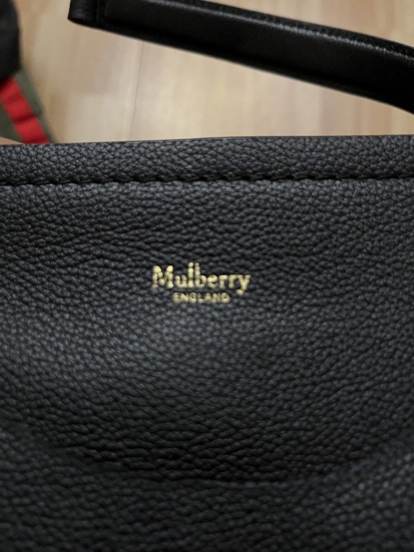 Authentic Mulberry Black Leather Shoulder Bag (Category: Luxury Bags & Wallets) located in Victorias. Submitted by lan1877 (Listing ID 1464707602, Image 3). Description: - Brand: Authentic Mulberry Bag - Material: Genuine black pebbled leather with luxurious suede lining - Hardware: Elegant gold-tone accents - Closure: Signature postman's lock on front flap - Versatility: Includes short top handles and an adjustable shoulder strap - Interior: Fea