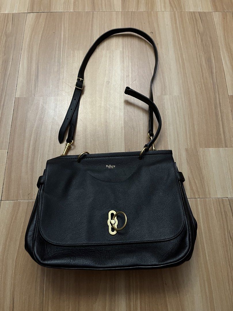 Authentic Mulberry Black Leather Shoulder Bag (Category: Luxury Bags & Wallets) located in Victorias. Submitted by lan1877 (Listing ID 1464707602, Image 1). Description: - Brand: Authentic Mulberry Bag - Material: Genuine black pebbled leather with luxurious suede lining - Hardware: Elegant gold-tone accents - Closure: Signature postman's lock on front flap - Versatility: Includes short top handles and an adjustable shoulder strap - Interior: Fea